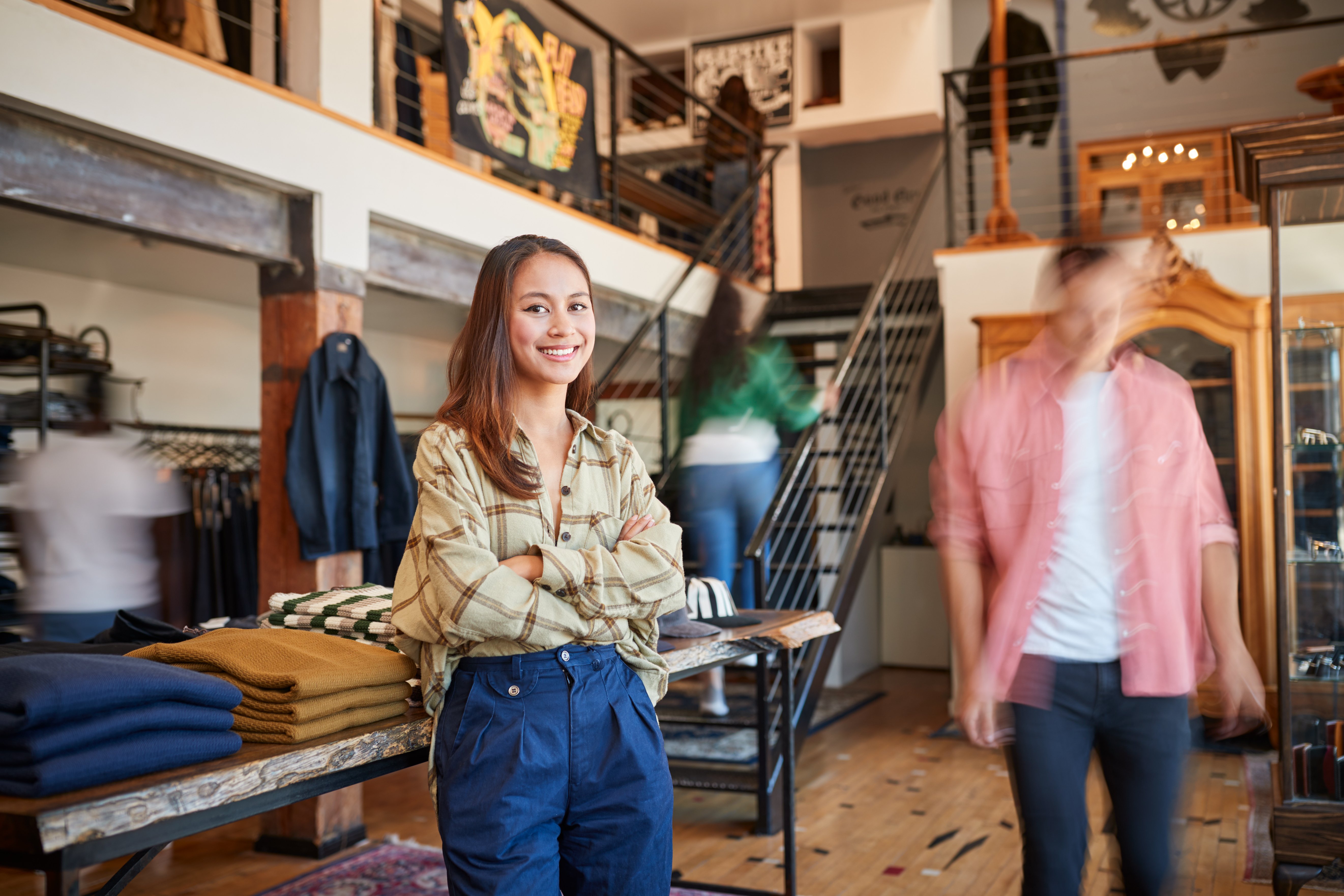 portrait-of-female-owner-of-fashion-store-standing-2024-10-20-13-12-03-utc