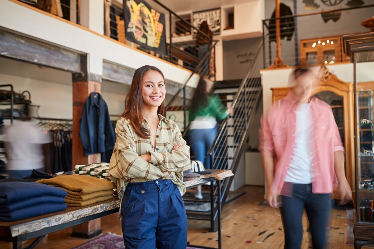 portrait-of-female-owner-of-fashion-store-standing-2024-10-20-13-12-03-utc